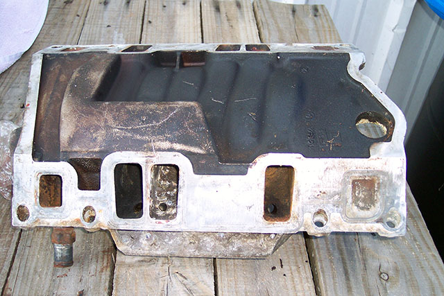 Intake manifold with carbon deposits.