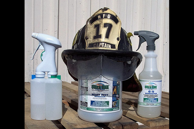 Half of Captain emblem on Fire fighter's helmet cleaned with Ultra One G5.